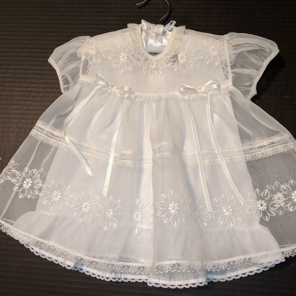 after image of vintage christening gown showing results of seam repair and stain removal