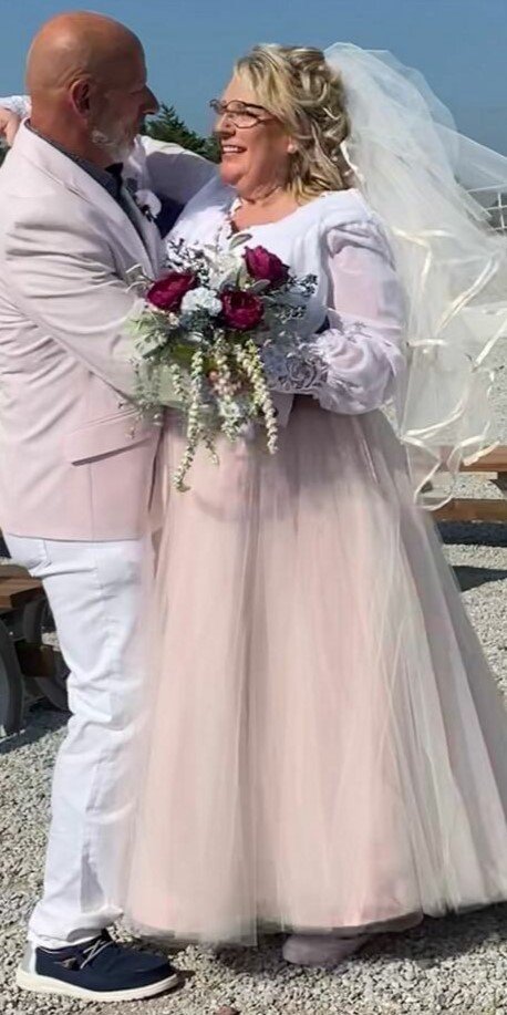 custom wedding ensemble with white, ivory, and pink color scheme and custom two piece blusher and veil